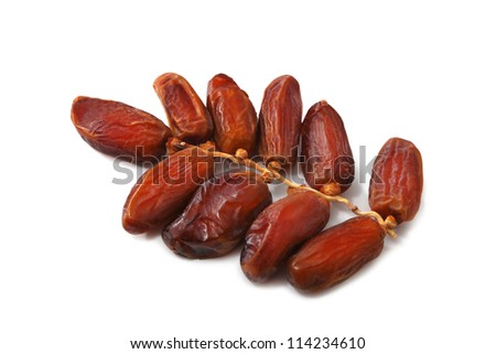 Dates growing on a date palm.