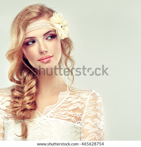 stock photo beautiful blonde model girl in white dress with a pigtail and flower barrette in her head 465628754