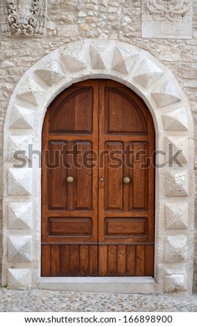  - stock-photo-a-massive-medieval-door-in-the-entrance-to-the-church-italy-166898900