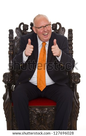 isolated businessman sitting on a throne - stock photo