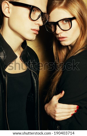 blond fashion twins in black clothes wearing trendy glasses and posing ... blond fashion twins in black clothes wearing trendy glasses and posing ...
