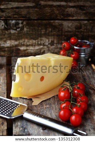 Про стоки Edam cheese on the wooden table - stock photo