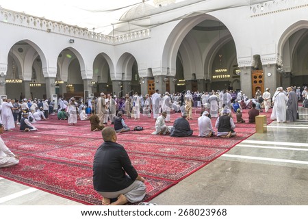 MEDINA, SAUDI ARABIA - MAR 07 : Muslims pray inside Masjid Quba March 07, 2015 in Medina, Saudi Arabia. This is the first mosque built by Prophet Muhammad (pbuh) in Islam
 - stock photo