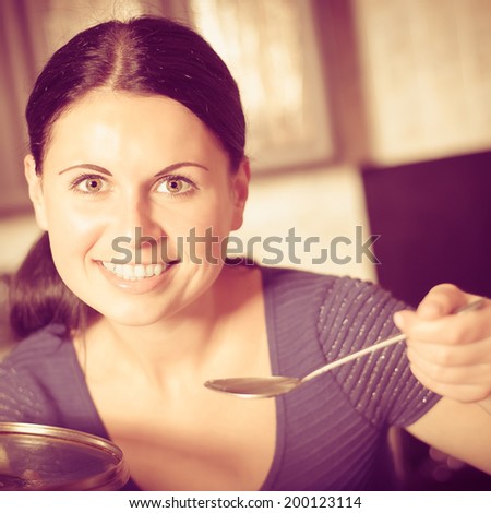 Young housewife cooks food in <b>kitchen. Soup</b>. Dinner. - stock-photo-young-housewife-cooks-food-in-kitchen-soup-dinner-photo-with-instagram-style-filters-200123114