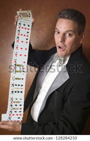 trick card magician performing magic shutterstock