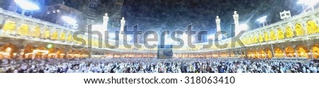 Muslim pilgrims circumambulate the Kaaba after dawn prayer at Masjidil Haram in Makkah, Saudi Arabia in panorama watercolor illustration.Muslims all around the world face the Kaaba during prayer time. - stock photo