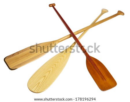 three wooden canoe paddles isolated on white with clipping paths 