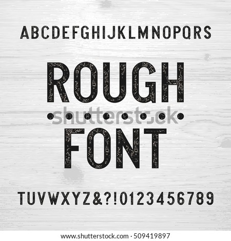 Rough alphabet font. Scratched type letters and numbers on a wooden background. Retro stock vector typography for your design. Rough alphabet font. Scratched type letters and numbers on a wooden background. Retro stock vector typography for your design.