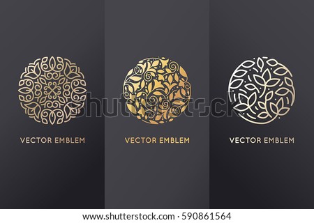 Vector set of logo design templates in trendy linear style with flowers and leaves - signs made with golden foil on black background - luxury products, florist emblems, organic cosmetics packaging Vector set of logo design templates in trendy linear style with flowers and leaves - signs made with golden foil on black background - luxury products, florist emblems, organic cosmetics packaging