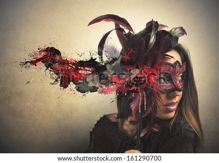 Beautiful woman with red and black carnival mask - stock photo