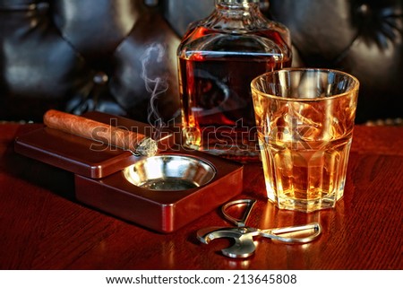 stock-photo-a-glass-of-whiskey-and-cigar