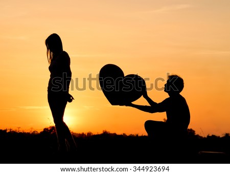 http://thumb1.shutterstock.com/display_pic_with_logo/1818128/344923694/stock-photo-man-begging-a-woman-for-love-by-giving-a-big-heart-344923694.jpg
