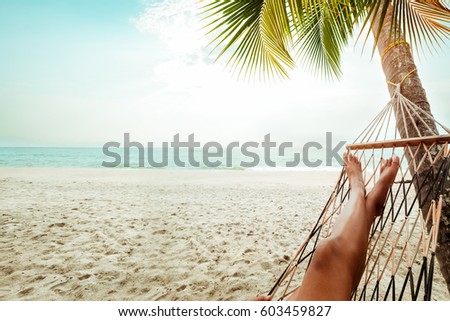 http://thumb1.shutterstock.com/display_pic_with_logo/1872044/603459827/stock-photo-leisure-in-summer-beautiful-tanned-legs-of-sexy-women-relax-on-hammock-at-sandy-tropical-beach-603459827.jpg