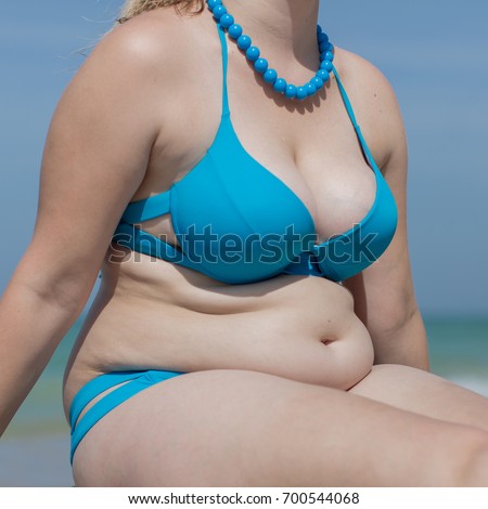 Attractive Blonde Women Is Sunbathing At The Beach Stock 