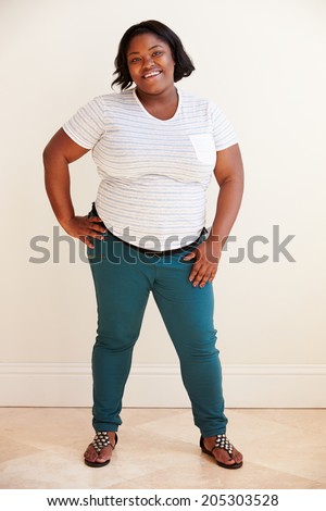 stock-photo-studio-portrait-of-smiling-overweight-woman-205303528.jpg