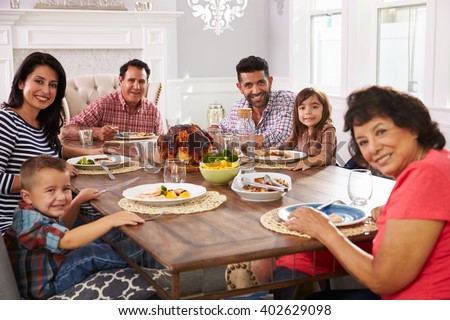 family hispanic meal table enjoying extended shutterstock lightbox create