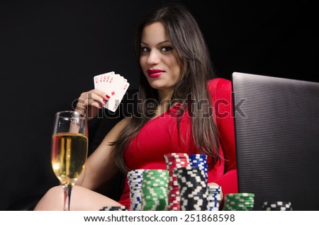 stock-photo-sexy-young-woman-playing-poker-online-holding-royal-flush-251868598.jpg