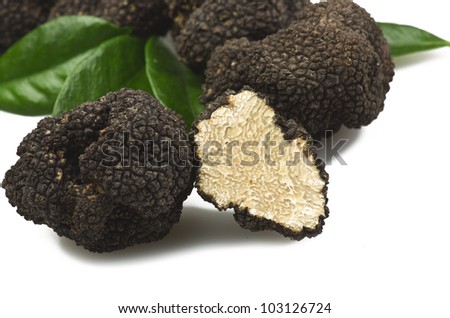 stock-photo-freshly-harvested-truffles-and-sliced-close-up-103126724.jpg