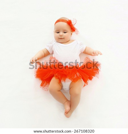 stock-photo-cute-little-baby-girl-lying-in-the-red-skirt-top-view-267108320.jpg