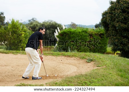 http://thumb1.shutterstock.com/display_pic_with_logo/2324765/224327494/stock-photo-golfer-man-playing-on-golf-sand-trap-wealthy-man-at-recreation-playing-golf-on-green-course-man-224327494.jpg