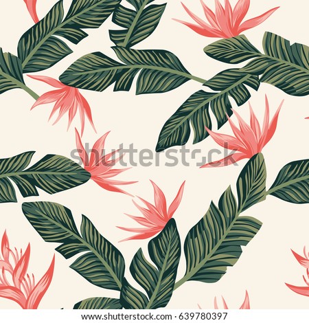 Beach cheerful seamless pattern wallpaper of tropical dark green leaves of palm trees and flowers bird of paradise (strelitzia) on a light yellow background Beach cheerful seamless pattern wallpaper of tropical dark green leaves of palm trees and flowers bird of paradise (strelitzia) on a light yellow background