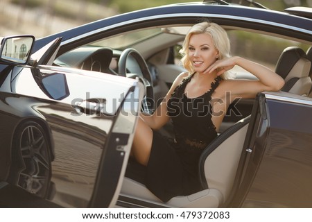 http://thumb1.shutterstock.com/display_pic_with_logo/2457938/479372083/stock-photo-fashion-outdoor-portrait-of-sexy-blonde-woman-in-black-dress-at-luxury-car-sensual-blond-model-in-479372083.jpg