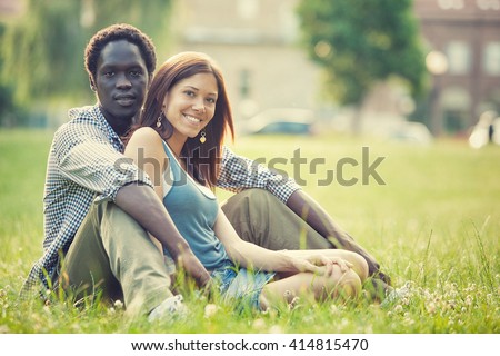 http://thumb1.shutterstock.com/display_pic_with_logo/2677924/414815470/stock-photo-young-multi-ethnic-couple-having-fun-together-at-the-park-414815470.jpg