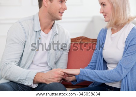 http://thumb1.shutterstock.com/display_pic_with_logo/2711341/345058634/stock-photo-beautiful-young-husband-and-wife-are-talking-and-smiling-they-are-sitting-and-holding-hands-the-345058634.jpg