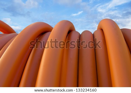 stock-photo-close-up-of-orange-cable-on-blue-sky-133234160.jpg