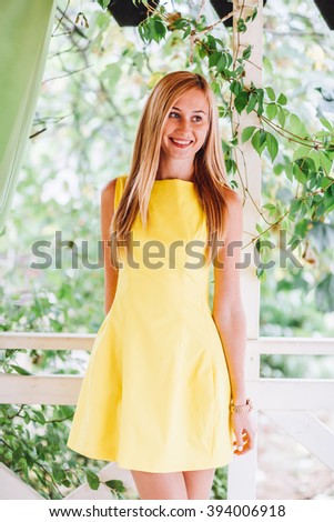 http://thumb1.shutterstock.com/display_pic_with_logo/2982691/394006918/stock-photo-beautiful-blonde-young-woman-wearing-yellow-summer-dress-posing-in-the-park-394006918.jpg