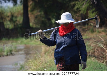 stock-photo-thai-farmer-carrying-hoe-292