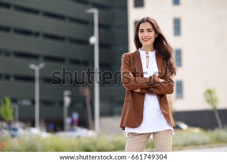 stock photo young woman with nice hair standing outside of office building businesswoman wearing formal wear 661749304