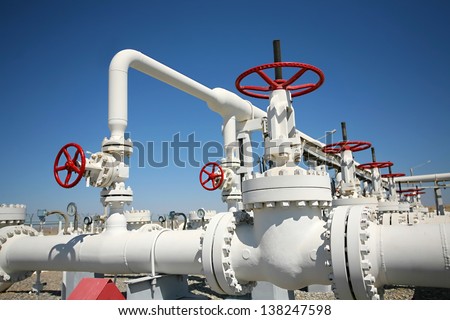 Oil and gas processing plant with pipe line valves - stock photo