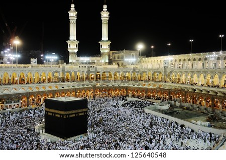 MECCA - JULY 21 : Pilgrims inside the Kaaba on July 21, 2012 in Mecca, Saudi Arabia.  Kaaba in Mecca is the holiest and most visited mosque for all Muslims. - stock photo