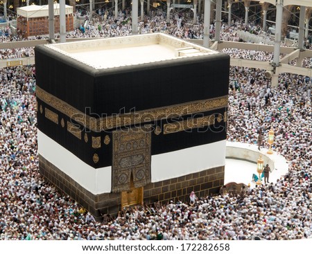 Kaaba the Holy mosque in Mecca with Muslim people pilgrims of Hajj praying in crowd (newest and very rare images of Holiest mosque after latest widening 2013-3014) - stock photo