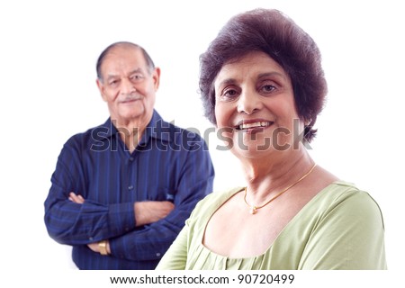 http://thumb1.shutterstock.com/display_pic_with_logo/42/42,1323793371,4/stock-photo-portrait-of-a-smiling-elderly-east-indian-woman-with-her-husband-in-the-background-90720499.jpg