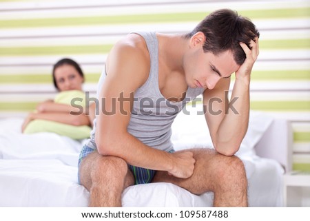 stock-photo-unhappy-young-couple-with-problem-in-bedroom-109587488.jpg