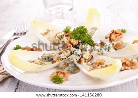 chicory salad with walnut and roquefort - stock photo