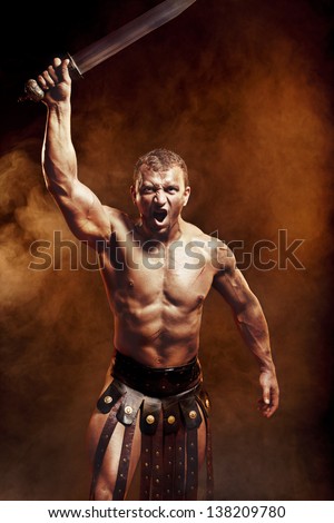 Gladiator with sword in smoke - stock photo