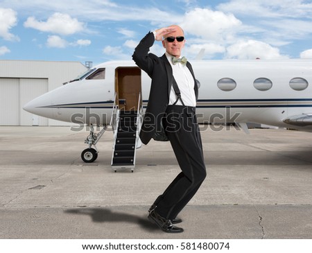 http://thumb1.shutterstock.com/display_pic_with_logo/458665/581480074/stock-photo-handsome-man-standing-in-front-of-a-jet-581480074.jpg