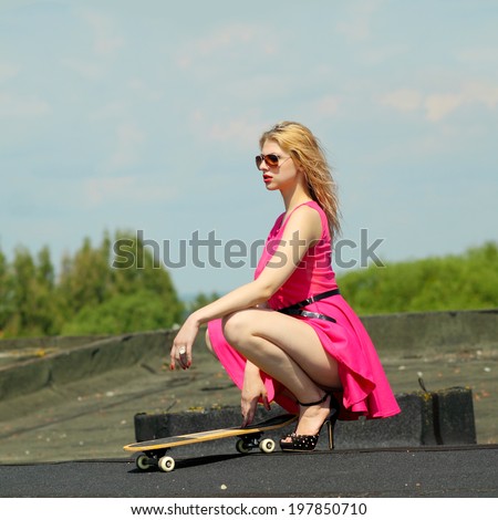 stock-photo-beautiful-fashionable-sexy-girl-in-sunglasses-in-high-heels-having-fun-on-a-skateboard-on-the-roof-197850710.jpg