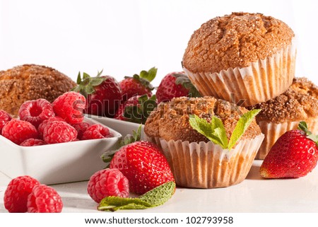 stock-photo-homemade-muffins-with-fresh-strawberries-and-raspberries-on-white-table-102793958.jpg