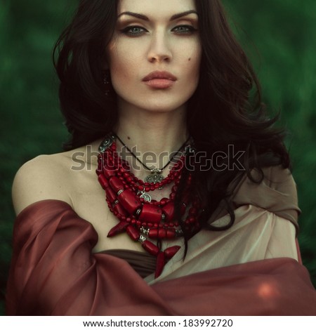 http://thumb1.shutterstock.com/display_pic_with_logo/539842/183992720/stock-photo-beautiful-dark-haired-girl-in-a-red-coif-was-lost-in-the-wild-forest-183992720.jpg