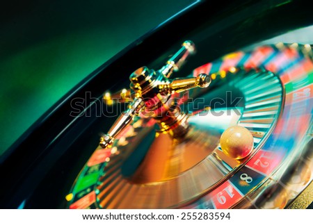 stock-photo-high-contrast-image-of-casino-roulette-in-motion-selective-focus-on-ball-255283594.jpg