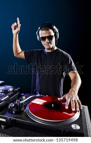 stock-photo-dj-playing-disco-electro-music-in-a-concert-135719498.jpg