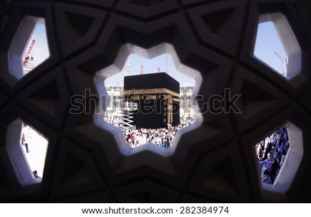 MECCA, SAUDI ARABIA-CIRCA MAY 2015: Muslims are doing tawaf around the Kaaba in Masjidil Haram on MAY, 2015 in Makkah, Saudi Arabia. Muslims all around the world come here doing umrah and hajj - stock photo