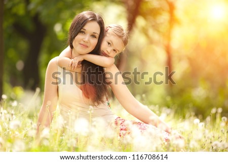 Mother and daughter in the park - stock photo