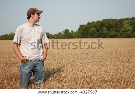 stock-photo-farmer-looking-at-his-wheat-crop-4327567.jpg