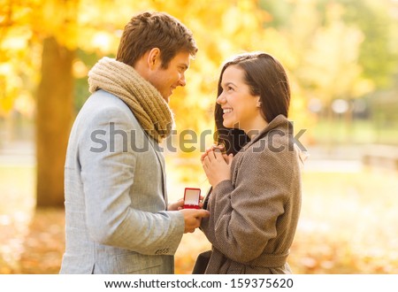 http://thumb1.shutterstock.com/display_pic_with_logo/64260/159375620/stock-photo-holidays-love-couple-relationship-and-dating-concept-romantic-man-proposing-to-a-woman-in-the-159375620.jpg