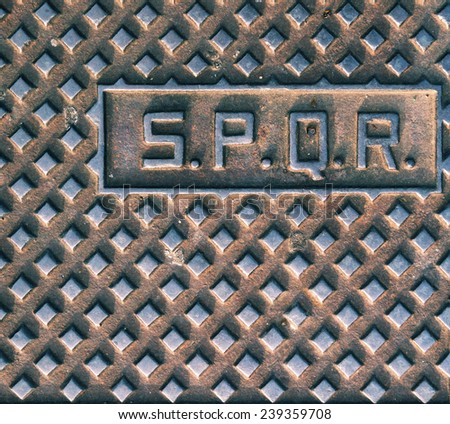 stock-photo-spqr-typical-manhole-cover-i